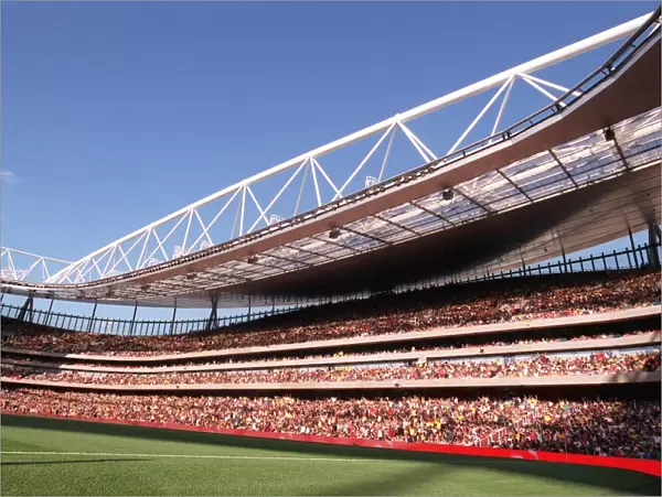 A mexican wave goes around Emirates Stadium, east side