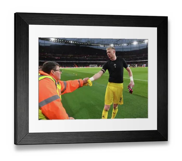 Framed Print : Arsenal's Aaron Ramsdale Gifts Shirt to Fan After Arsenal v Brentford Match Framed Print : Arsenal's Aaron Ramsdale Gifts Shirt to Fan After Arsenal v Brentford Match