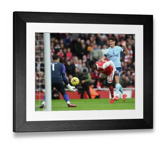 Framed Print : Arsenal vs Brentford: Bukayo Saka Faces Off Against Christian Norgaard in Premier League Clash Framed Print : Arsenal vs Brentford: Bukayo Saka Faces Off Against Christian Norgaard in Premier League Clash