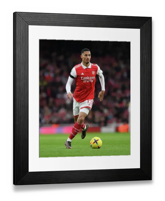 Framed Print : Arsenal's William Saliba Faces Off Against Brentford in Premier League Clash at Emirates Stadium