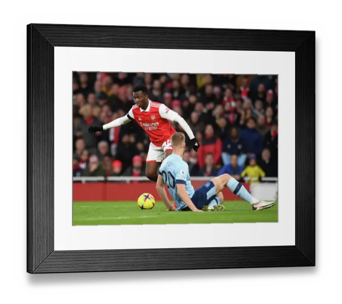 Framed Print : Arsenal vs Brentford: Eddie Nketiah Clashes with Kristoffer Ajer in Premier League Showdown at Emirates Stadium