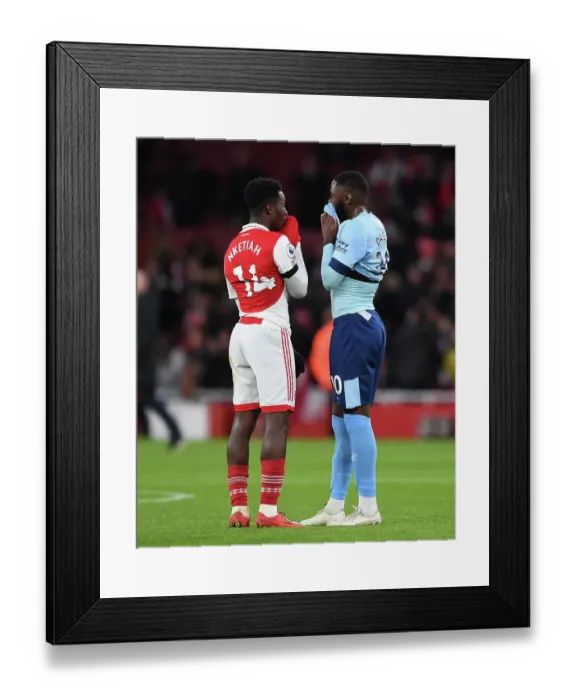 Framed Print : Arsenal's Eddie Nketiah and Brentford's Josh Dasilva Share a Moment After Arsenal FC vs Brentford FC in Premier League Framed Print : Arsenal's Eddie Nketiah and Brentford's Josh Dasilva Share a Moment After Arsenal FC vs Brentford FC in Premier League