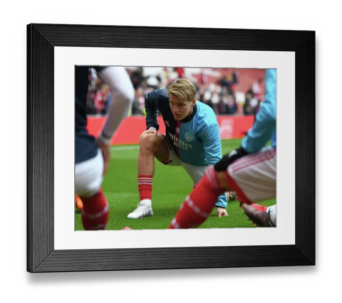 Framed Print : Arsenal's Martin Odegaard Gears Up for Arsenal v Brentford Premier League Clash at Emirates Stadium