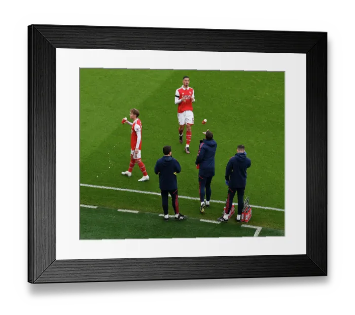 Framed Print : Arsenal: Martin Odegaard and William Saliba Share a Moment Before Arsenal v Brentford (2022-23)