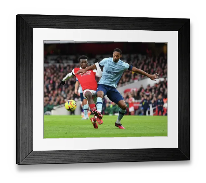 Framed Print : Nketiah vs. Pinnock: A Premier League Showdown at Emirates Stadium - Arsenal vs. Brentford