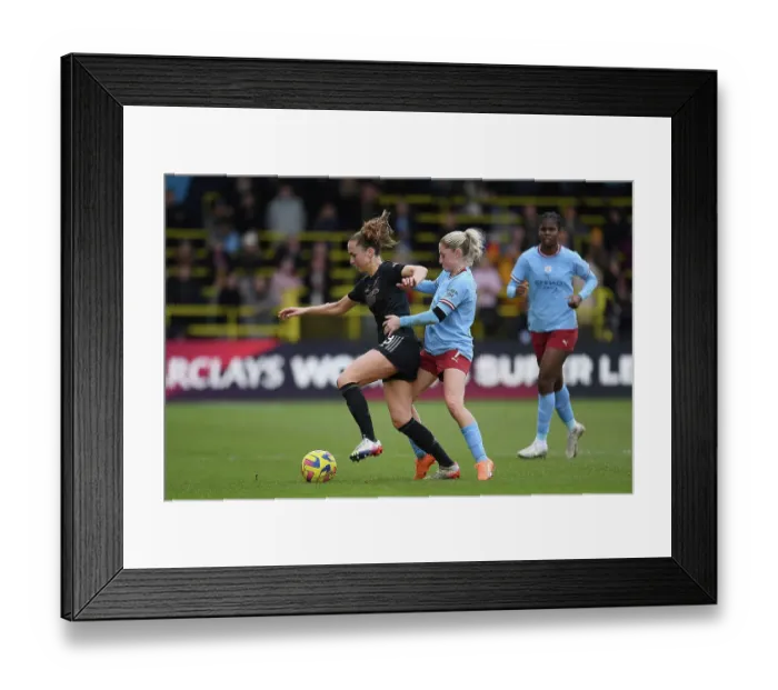 Framed Print : Arsenal vs Manchester City: Intense Battle in FA Women's Super League