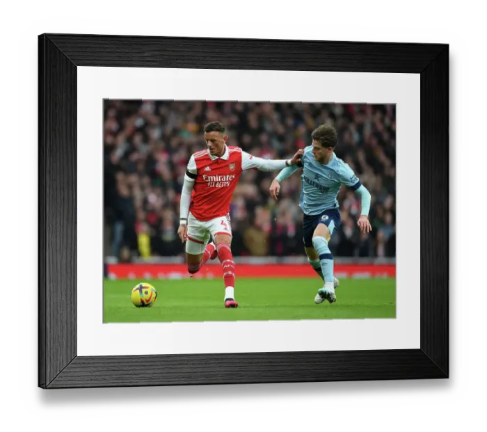 Framed Print : Arsenal's Ben White Clashes with Brentford's Mathias Jensen in Premier League Showdown Framed Print : Arsenal's Ben White Clashes with Brentford's Mathias Jensen in Premier League Showdown