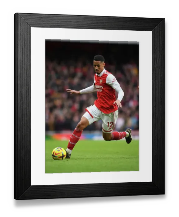 Framed Print : Arsenal's William Saliba in Action Against Brentford in the Premier League Framed Print : Arsenal's William Saliba in Action Against Brentford in the Premier League