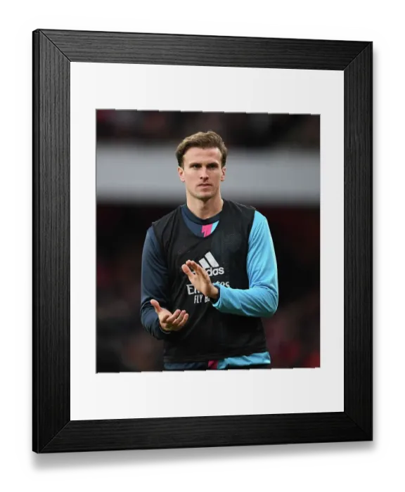Framed Print : Arsenal's Rob Holding in Action against Brentford in the Premier League