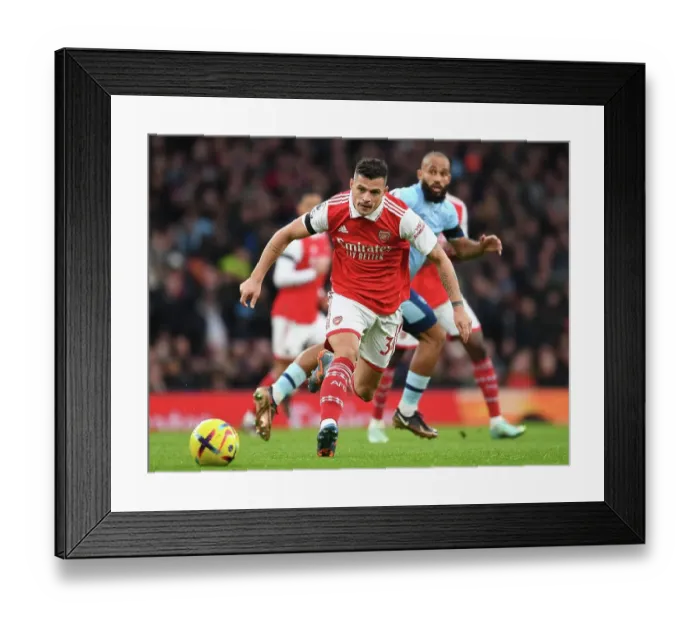 Framed Print : Arsenal's Granit Xhaka in Action Against Brentford in the Premier League Framed Print : Arsenal's Granit Xhaka in Action Against Brentford in the Premier League