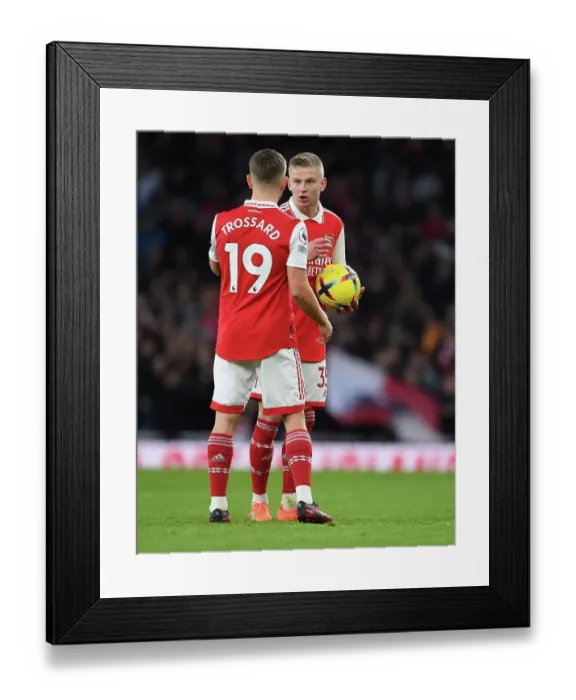 Framed Print : Arsenal FC vs Brentford FC: Trossard and Zinchenko in Action during the 2022-23 Premier League Clash at Emirates Stadium