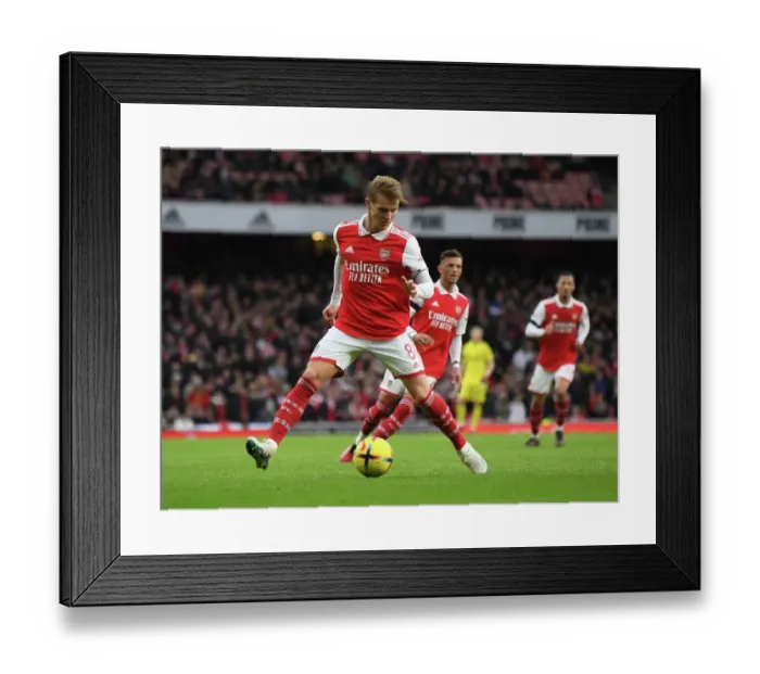 Framed Print : Martin Odegaard's Brilliant Performance: Arsenal's Triumph Over Brentford in the 2023 Premier League Framed Print : Martin Odegaard's Brilliant Performance: Arsenal's Triumph Over Brentford in the 2023 Premier League