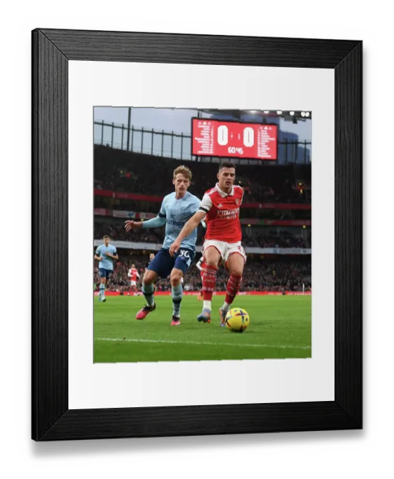 Framed Print : Xhaka vs. Roerslev: A Battle of Midfielders in Arsenal vs. Brentford Premier League Clash