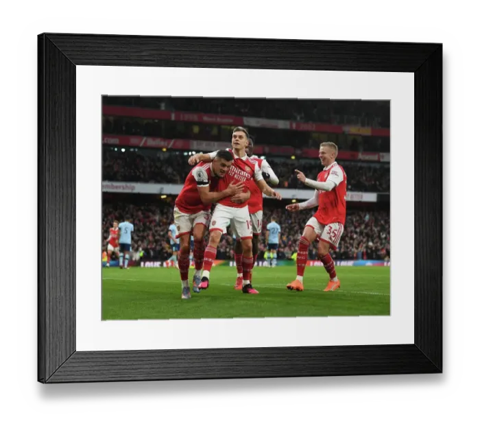 Framed Print : Arsenal's Trossard, Xhaka, and Zinchenko Celebrate Goal Against Brentford in Premier League