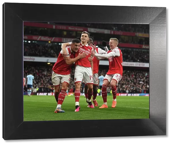Arsenal's Xhaka, Zinchenko, and Trossard Celebrate Goal Against Brentford (2022-23)