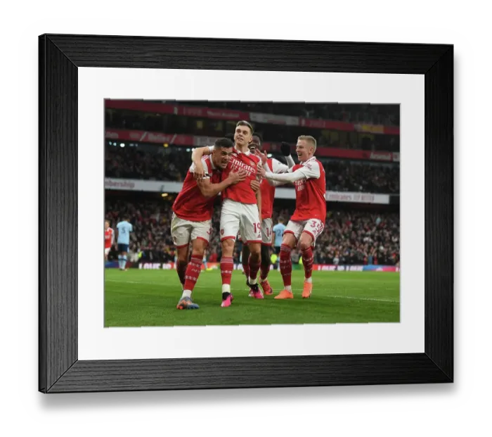 Framed Print : Arsenal's Xhaka, Zinchenko, and Trossard Celebrate Goal Against Brentford (2022-23)