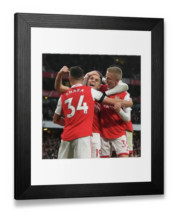 Framed Print : Arsenal Triumph: Xhaka, Zinchenko, and Trossard Celebrate Goal Against Brentford (2022-23)