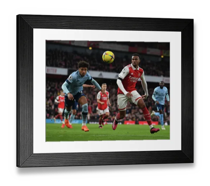 Framed Print : Arsenal vs Brentford: Gabriel vs Schade - Intense Battle in the Premier League Framed Print : Arsenal vs Brentford: Gabriel vs Schade - Intense Battle in the Premier League
