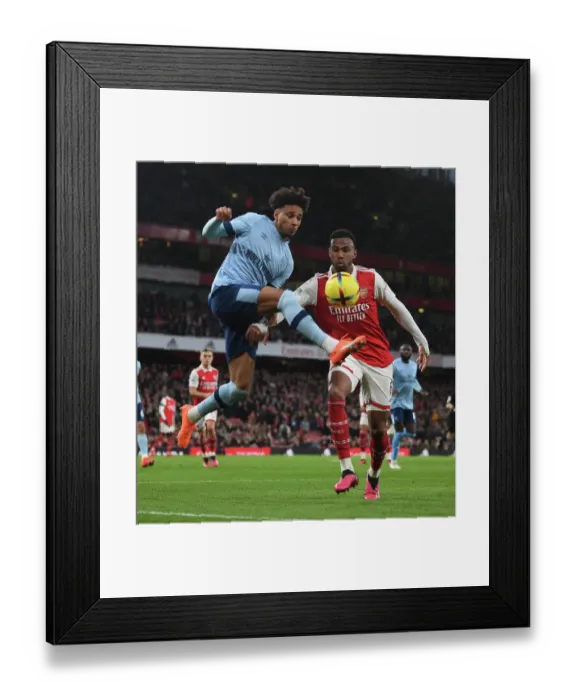 Framed Print : Arsenal vs. Brentford: Gabriel vs. Schade - Premier League Clash at Emirates Stadium Framed Print : Arsenal vs. Brentford: Gabriel vs. Schade - Premier League Clash at Emirates Stadium
