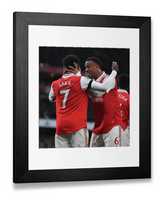 Framed Print : Arsenal's Saka and Gabriel Clash in Intense Battle at Emirates: Arsenal vs. Brentford, Premier League 2022-23