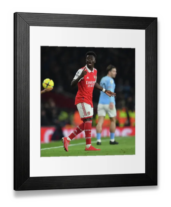 Framed Print : Bukayo Saka in Action: Arsenal vs Manchester City, Premier League 2022-23 Framed Print : Bukayo Saka in Action: Arsenal vs Manchester City, Premier League 2022-23