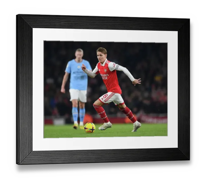 Framed Print : Arsenal's Odegaard Takes on Manchester City: A Midfield Battle Framed Print : Arsenal's Odegaard Takes on Manchester City: A Midfield Battle