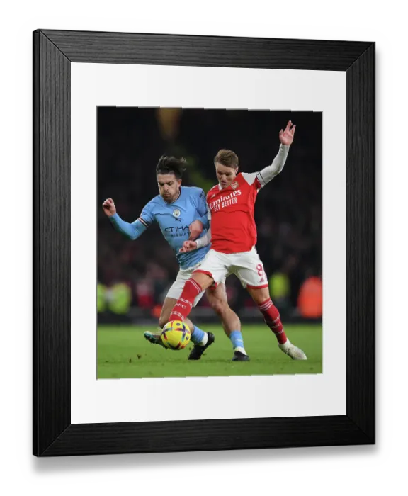 Framed Print : Odegaard Outmuscles Grealish: Arsenal's Midfield Maestro Wins Battle Against Manchester City Star Framed Print : Odegaard Outmuscles Grealish: Arsenal's Midfield Maestro Wins Battle Against Manchester City Star