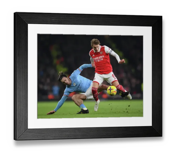 Framed Print : Arsenal's Martin Odegaard Outsmarts Jack Grealish: Intense Battle in Arsenal vs. Manchester City Framed Print : Arsenal's Martin Odegaard Outsmarts Jack Grealish: Intense Battle in Arsenal vs. Manchester City