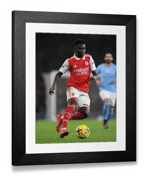 Framed Print : Bukayo Saka: Arsenal Star Shines in Premier League Clash Against Manchester City