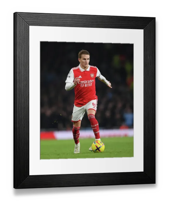 Framed Print : Martin Odegaard vs Manchester City: Arsenal's Midfield Maestro Takes on Premier League Rivals