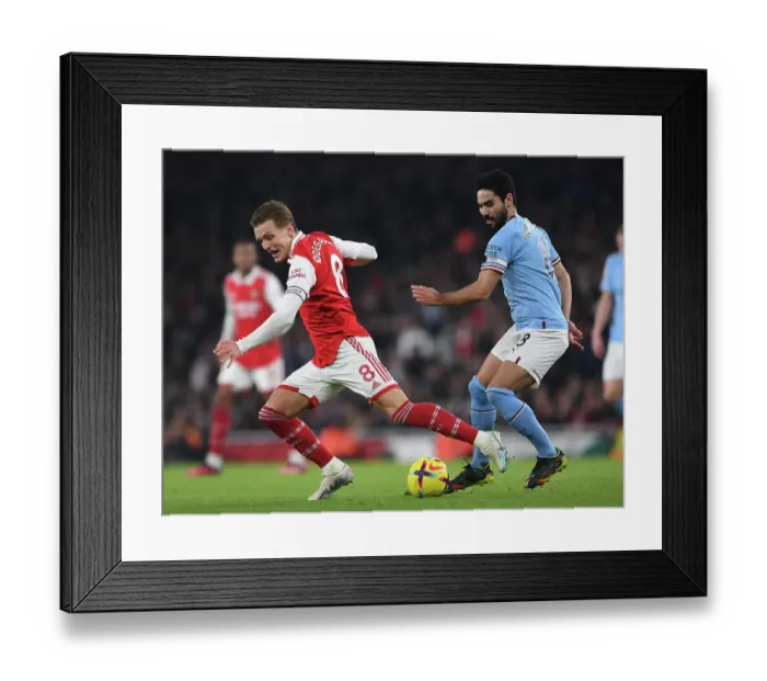 Framed Print : Arsenal vs Manchester City: Intense Battle between Odegaard and Gundogan in the 2022-23 Premier League Framed Print : Arsenal vs Manchester City: Intense Battle between Odegaard and Gundogan in the 2022-23 Premier League