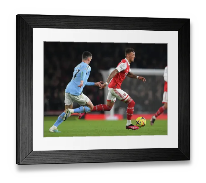 Framed Print : Arsenal's Ben White Faces Off Against Manchester City in Intense Premier League Showdown (2022-23)