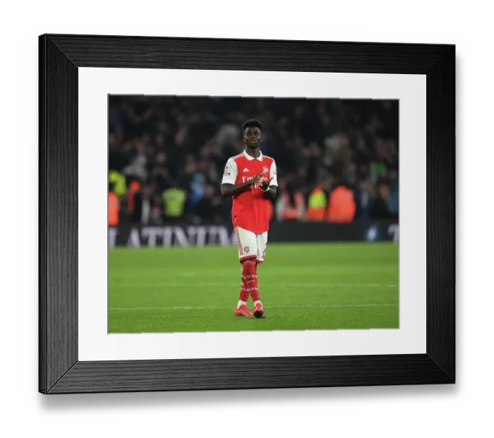 Framed Print : Arsenal's Bukayo Saka Celebrates with Fans after Arsenal vs Manchester City, Premier League 2022-23 Framed Print : Arsenal's Bukayo Saka Celebrates with Fans after Arsenal vs Manchester City, Premier League 2022-23