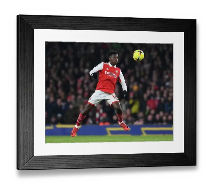 Framed Print : Arsenal's Eddie Nketiah Goes Head-to-Head with Manchester City in Premier League Battle