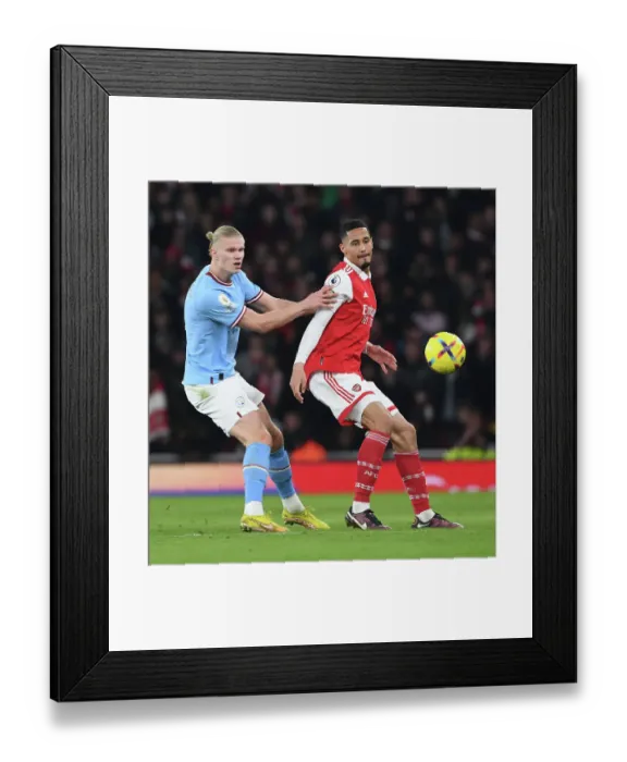 Framed Print : Saliba vs Haaland: A Star-Studded Clash in Arsenal vs Manchester City Premier League Showdown