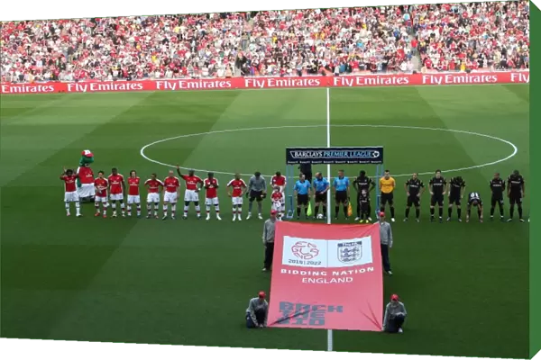 The Arsenal and Man City teams line up behiind Back the bid banner. Arsenal 0