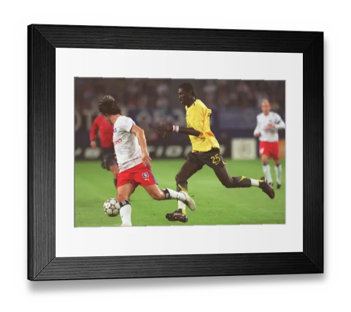 Framed Print : Adebayor's Double: Hamburg's 1-2 Defeat to Arsenal in Champions League Group G