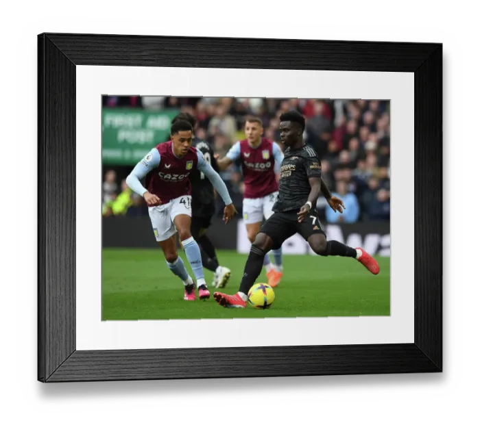 Framed Print : Clash at Villa Park: Buakyo Saka vs. Jacob Ramsey - Aston Villa vs. Arsenal FC, Premier League 2022-23