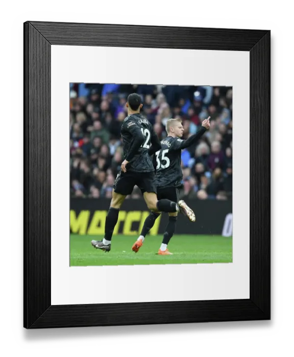 Framed Print : Arsenal's Zinchenko and Saliba Celebrate Goal Against Aston Villa in Premier League Clash (2022-23)