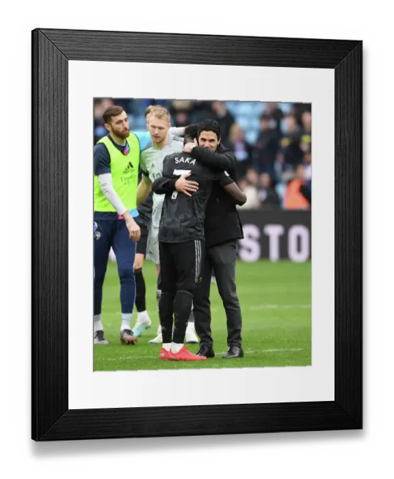 Framed Print : Arsenal's Mikel Arteta Embraces Bukayo Saka in Victory at Aston Villa, Premier League 2022-23
