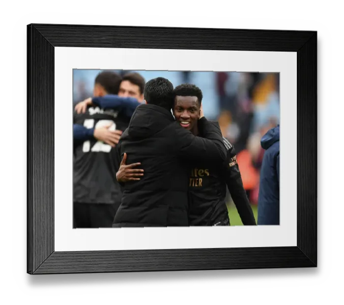 Framed Print : Arsenal's Mikel Arteta Embraces Eddie Nketiah in Victory at Aston Villa (Aston Villa vs Arsenal, Premier League 2022-23)