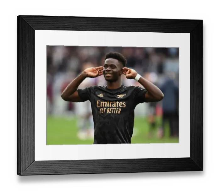 Framed Print : Bukayo Saka's Euphoric Celebration: Arsenal Secures Triumph Over Aston Villa in Premier League