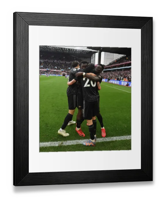 Framed Print : Arsenal Celebrate Own Goal by Aston Villa's Emi Martinez in Premier League Clash Framed Print : Arsenal Celebrate Own Goal by Aston Villa's Emi Martinez in Premier League Clash