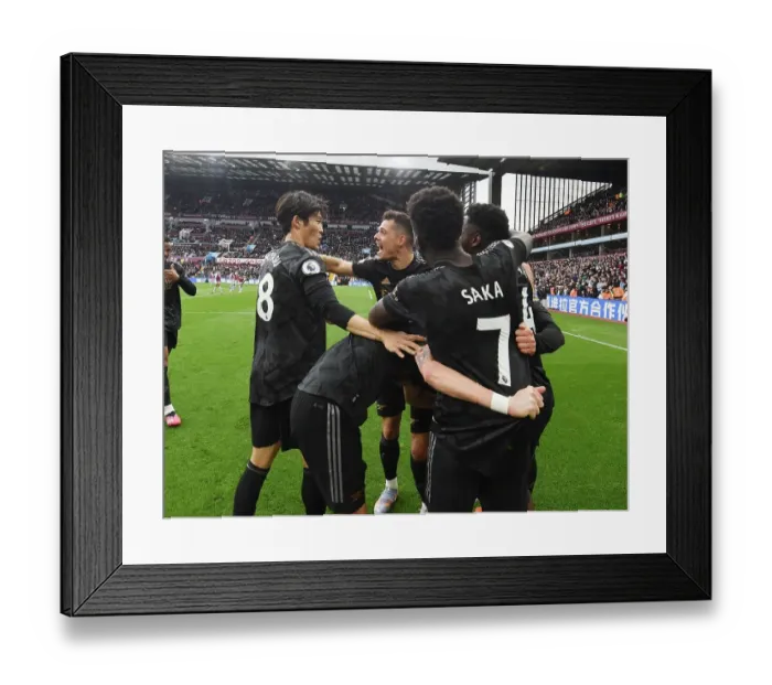 Framed Print : Arsenal Celebrate Own Goal by Aston Villa's Martinez in Premier League Clash Framed Print : Arsenal Celebrate Own Goal by Aston Villa's Martinez in Premier League Clash