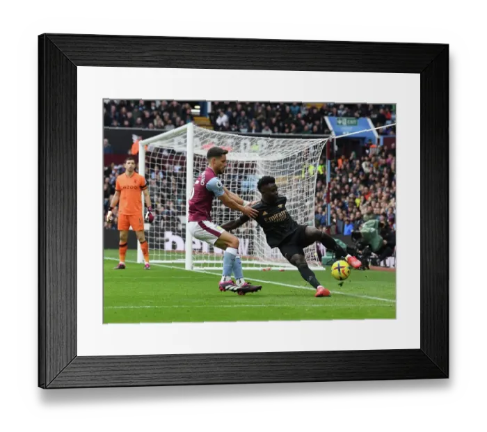 Framed Print : Saka vs Moreno: A Wing Battle at Villa Park - Intense Showdown between Arsenal's Bukayo Saka and Aston Villa's Alexandre Moreno, Premier League 2022-23