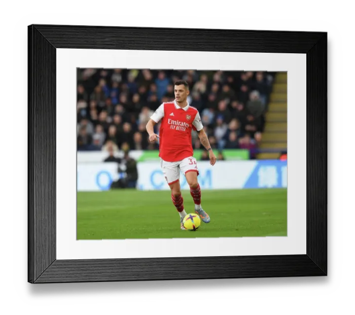 Framed Print : Granit Xhaka's Premier League Battle: Arsenal vs. Leicester City