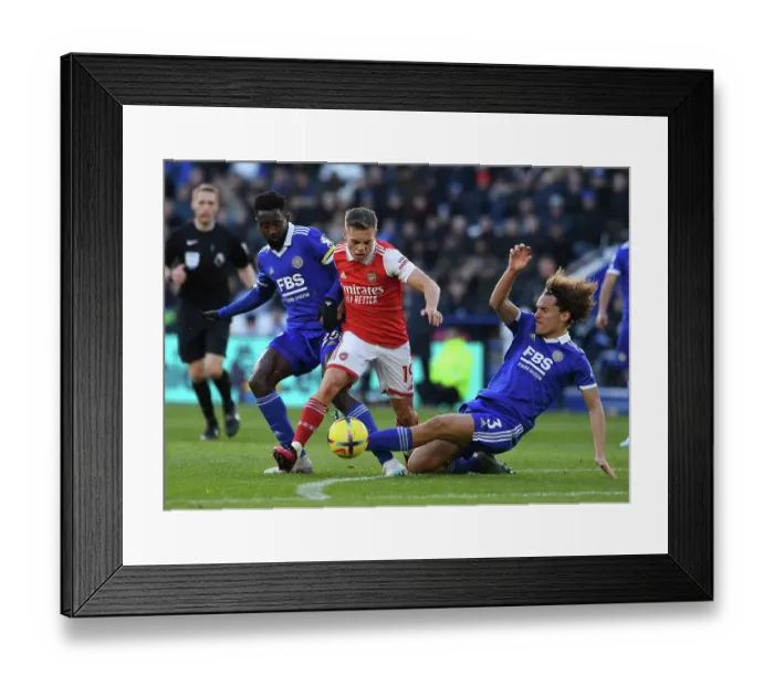 Framed Print : Leandro Trossard Clashes with Leicester's Faes and Ndidi in Arsenal's Premier League Battle