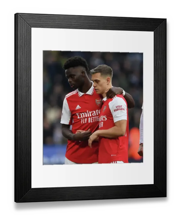 Framed Print : Bukayo Saka and Leandro Trossard Face Off: Leicester City vs. Arsenal FC, Premier League 2022-23