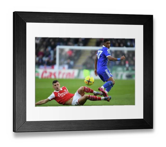 Framed Print : Granit Xhaka Tackles Tete in Intense Leicester City vs. Arsenal FC Clash, Premier League 2022-23