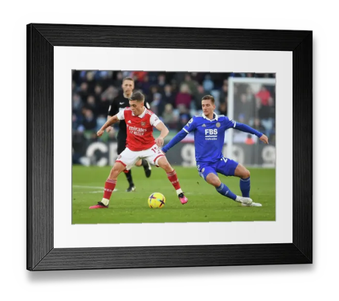 Framed Print : Leandro Trossard vs. Dennis Praet: Intense Battle in Leicester City vs. Arsenal FC Premier League Clash